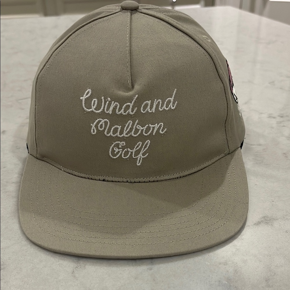 Malbon Golf x Wind & Sea collab on tan SnapBack hat in excellent condition